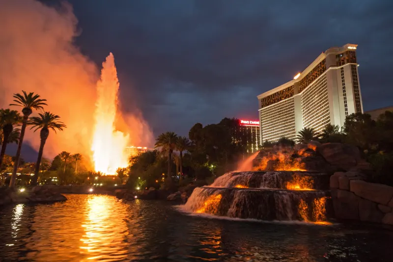 The Mirage casino volcano eruption show on the Las Vegas Strip at night with flames and water effects